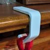 white stocking hanger for shelf