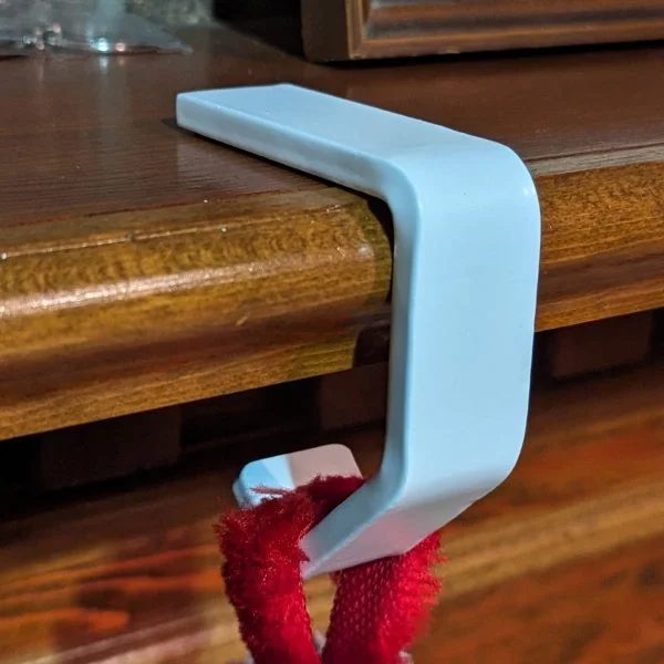 white stocking hanger for shelf
